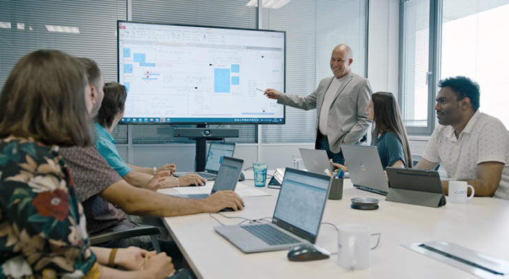 People in a meeting room discussing a plan