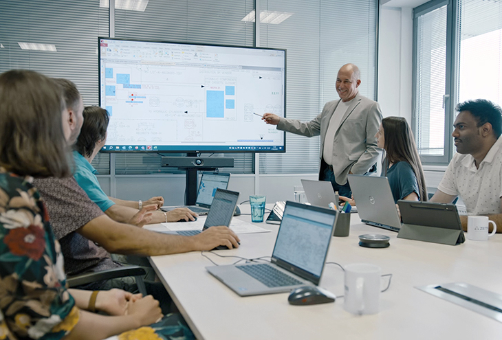People in a meeting room discussing a plan