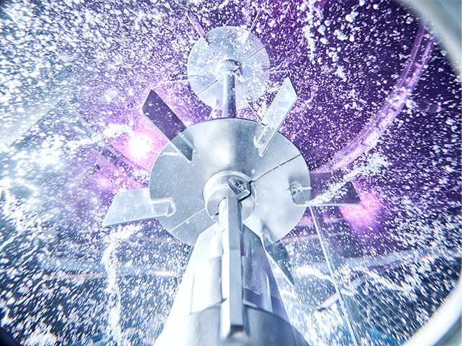Large rushton impeller in motion in large glass reactor