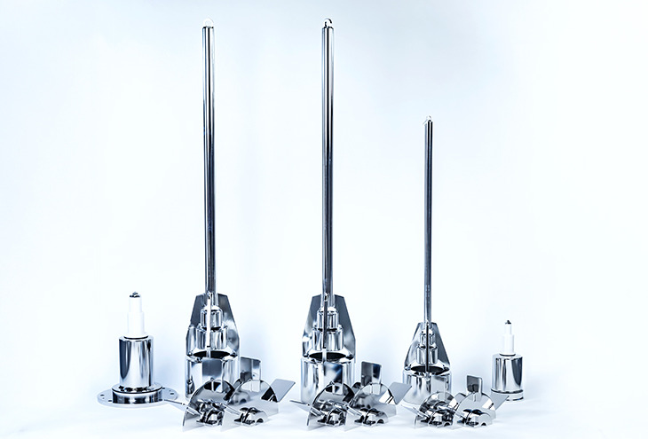 Three impeller shafts, flanges and rushton impellers, demounted