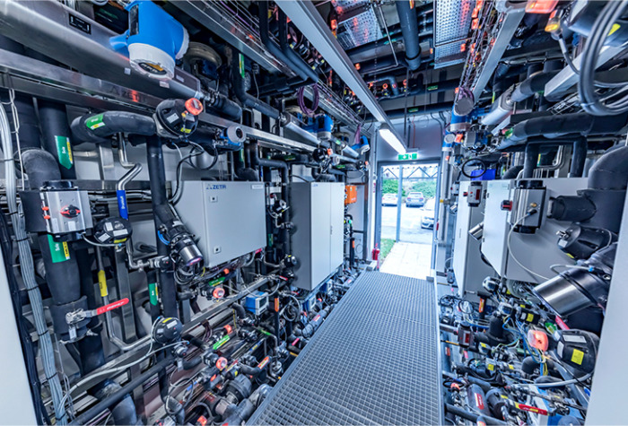 Technical area with corridor and open door facing outside